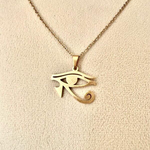 Oeil d'Horus (Brahma) pendentif acier doré inoxydable avec chaîne. 2,5 cm. Boutique ésotérique La Porte des Secrets